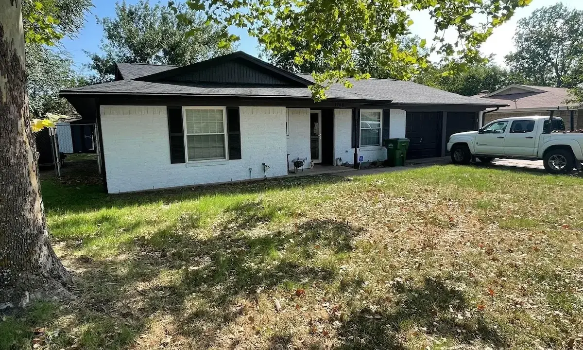 Professional roofing crew working on a residential roof in Bonita